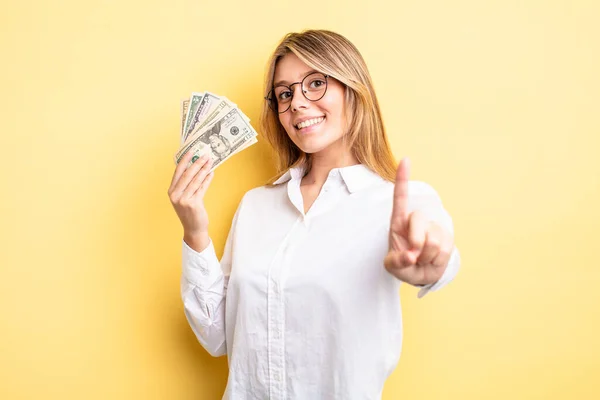 Pretty Blonde Girl Smiling Proudly Confidently Making Number One Dollar — Stock Photo, Image