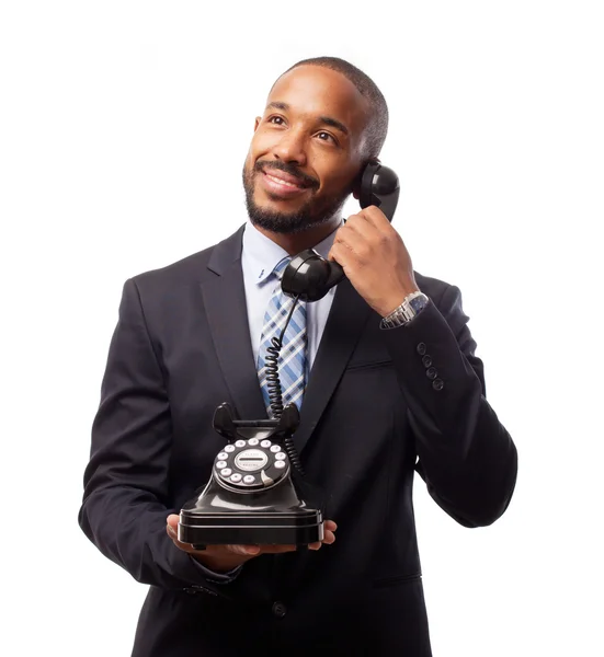 Young cool black man speaking at telephone — Stock Photo, Image