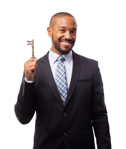 Young cool svart man med en gammal nyckel — Stockfoto