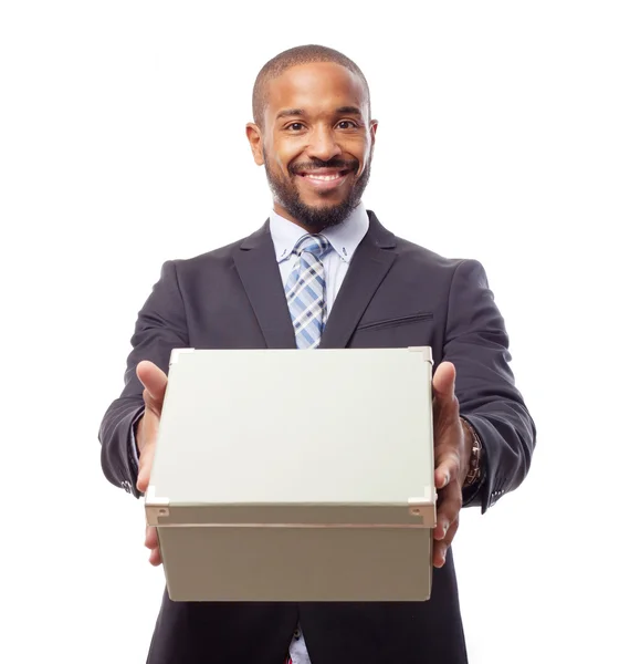 Joven fresco negro hombre con una caja — Foto de Stock