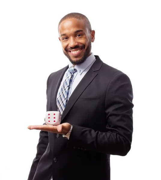 Young cool black man with a dice — Stock Photo, Image