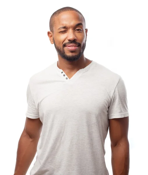 Young cool black man wink sign — Stock Photo, Image