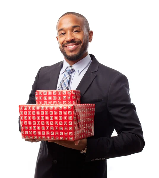 Young cool black man with gift boxes — Stock Photo, Image