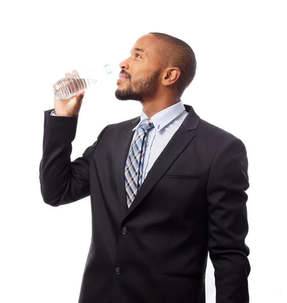 Genç serin siyah adam içme suyu — Stok fotoğraf