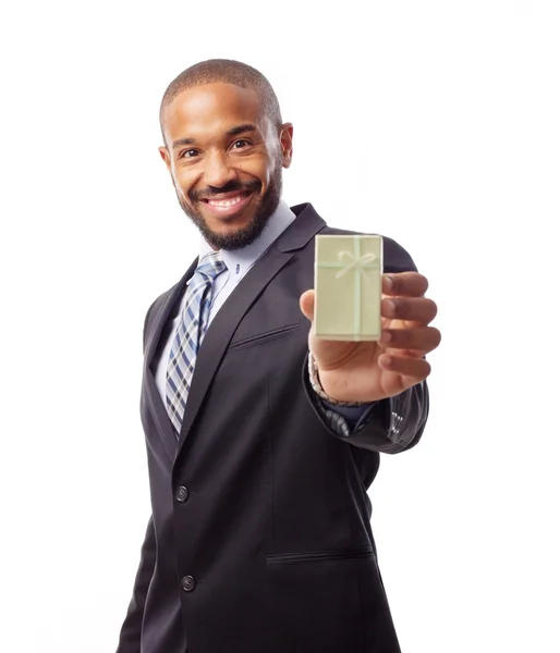 Young cool black man with giftbox — Stock Photo, Image