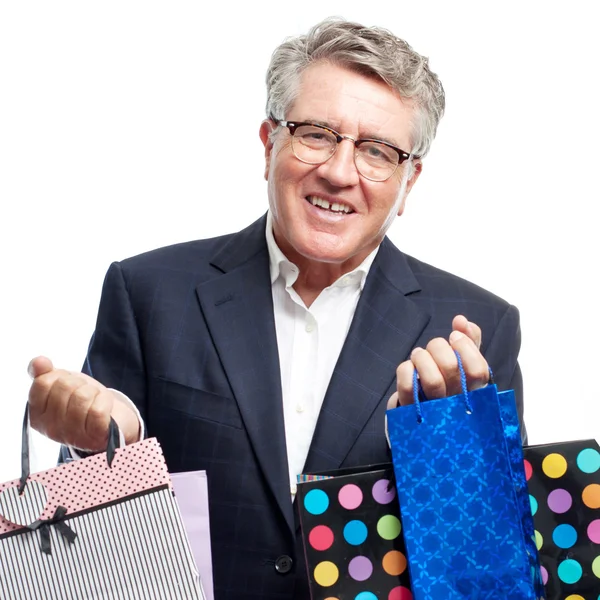 Hombre fresco senior con bolsas de compras — Foto de Stock