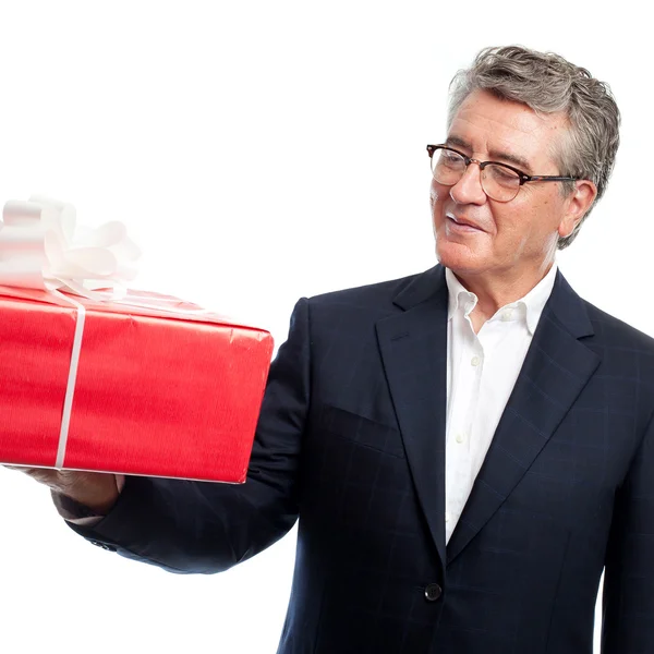 Senior cool man con un regalo — Foto Stock