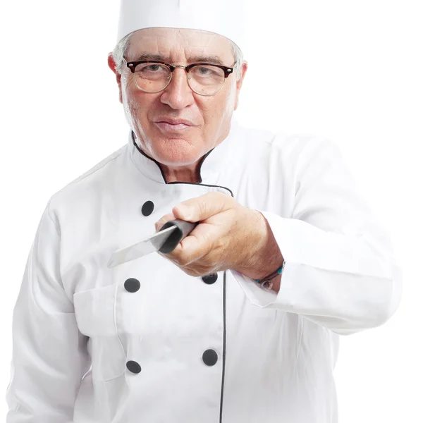 Senior onhartelijk mens met een mes — Stockfoto