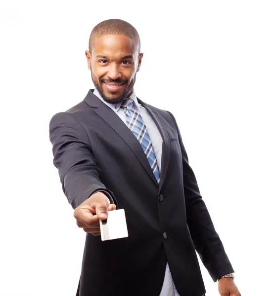 Young cool black man offering a credit card Stock Picture