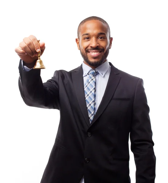 Young cool black man with a hand bell Royalty Free Stock Images