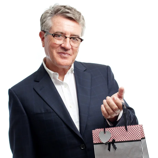 Hombre fresco senior con bolsa de compras — Foto de Stock