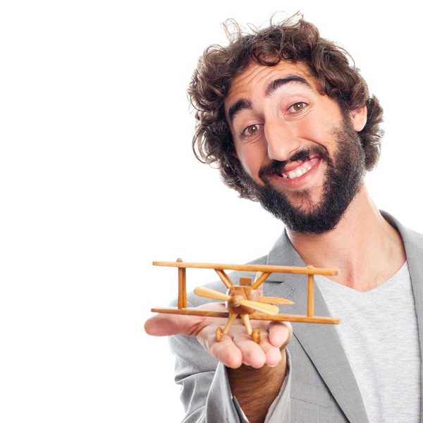 Joven loco con un avión de madera — Foto de Stock