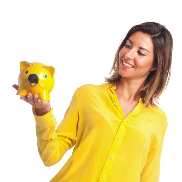 Young cool woman with piggy bank — Stock Photo, Image