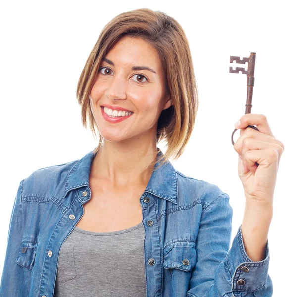 Young cool woman with a key — Stock Photo, Image