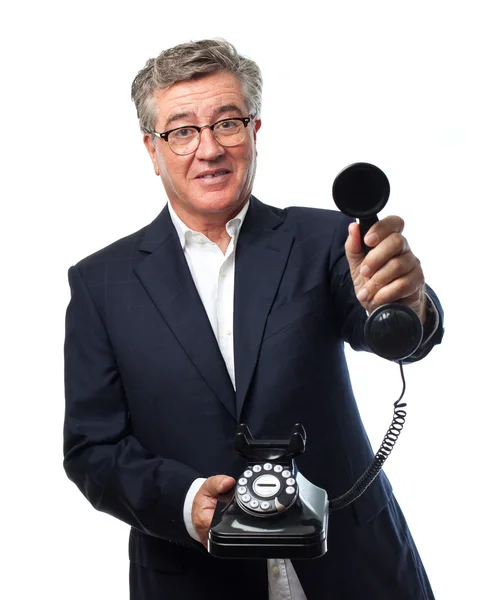 Senior cool man erbjuder en telefon — Stockfoto