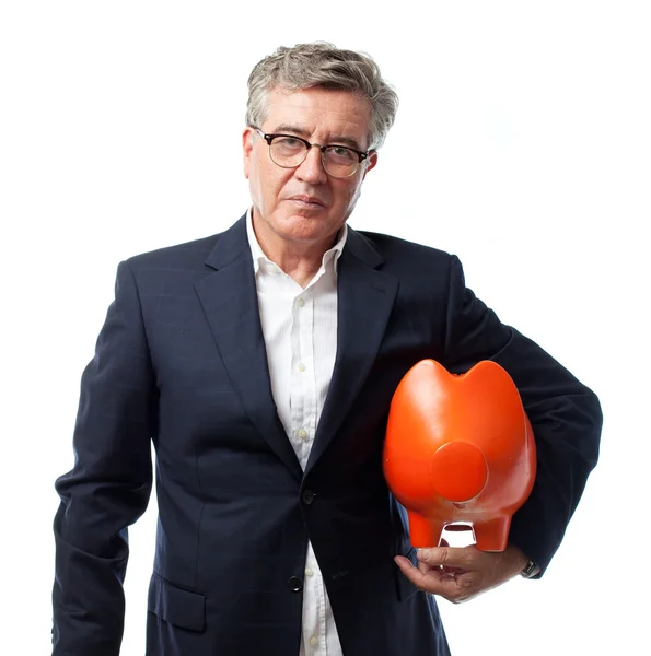 Senior cool man with a piggy bank — Stock Photo, Image