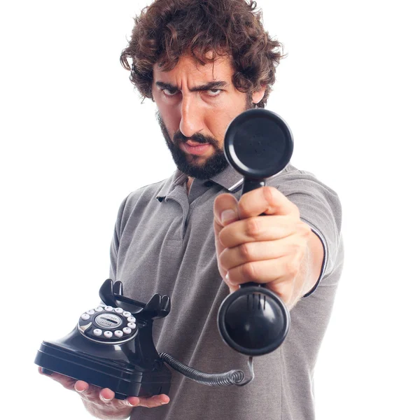 Jovem louco oferecendo um telefone — Fotografia de Stock