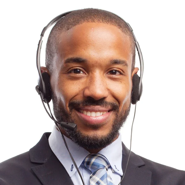 Jovem legal preto homem com telefones — Fotografia de Stock