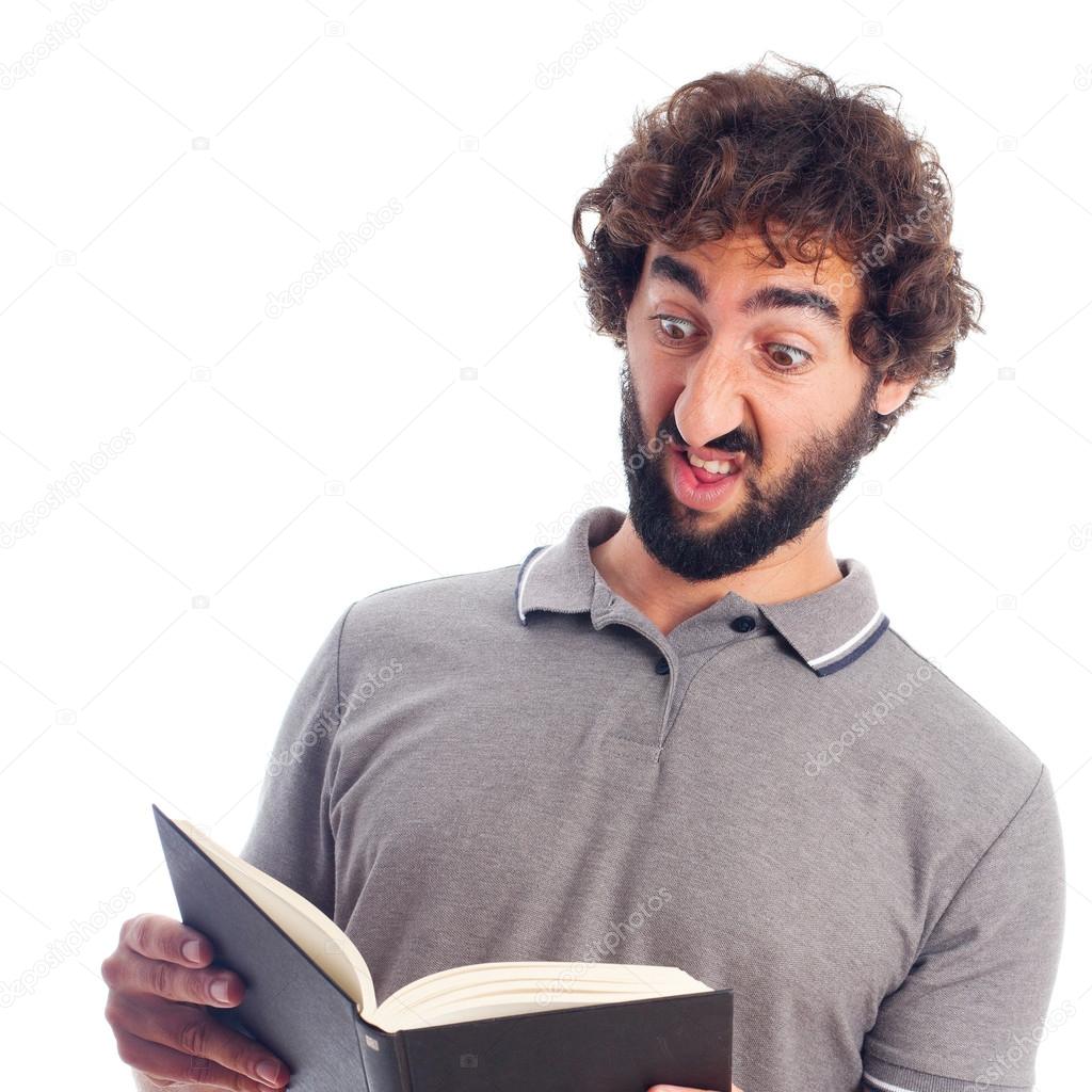 Young crazy man stranged with a book