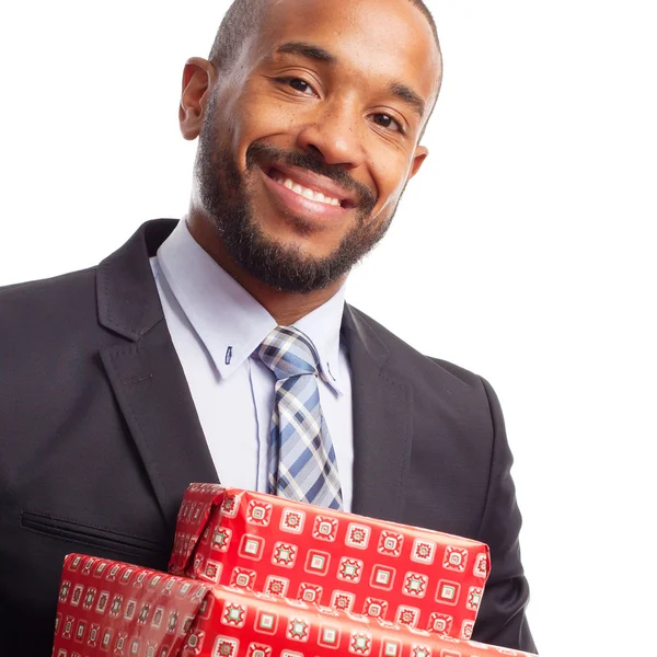 Young cool black man with gift boxes — Stock Photo, Image