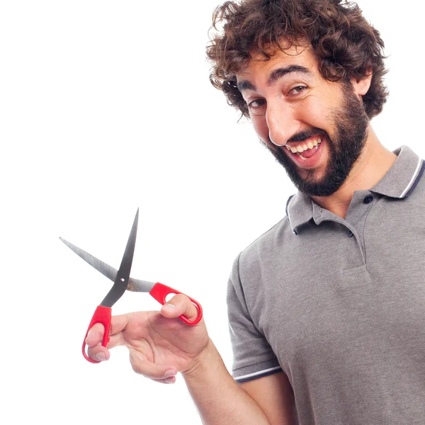 Jonge, bebaarde man met een schaar — Stockfoto