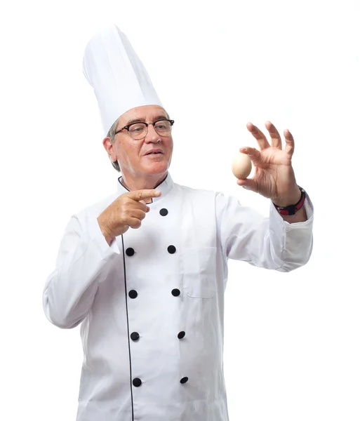 Senior cool man with an egg — Stock Photo, Image