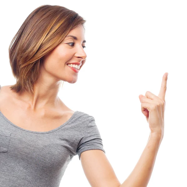 Young cool woman pointing up — Stock Photo, Image