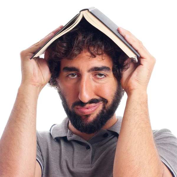 Gek jongeman saai met een boek — Stockfoto