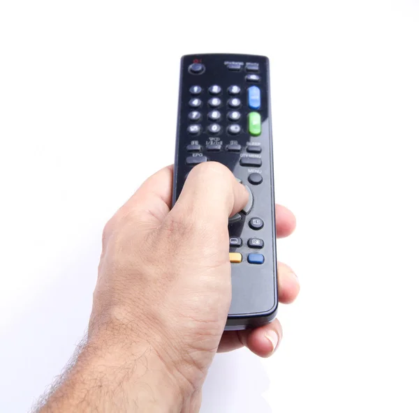 Man hand holding a tv remote Stock Picture