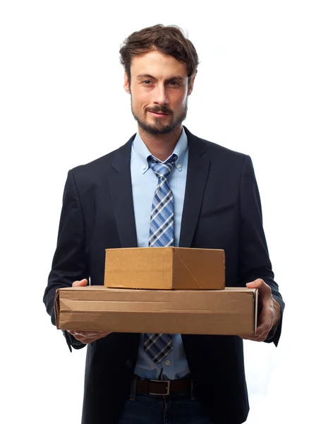 Young crazy businessman with boxes — Stock Photo, Image