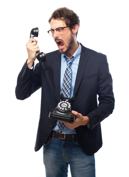 Young crazy businessman shouting at phone — Stock Photo, Image