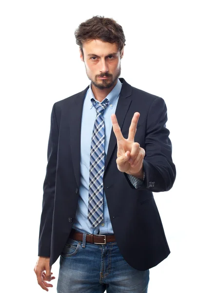 Young crazy businessman victory gesture — Stock Photo, Image