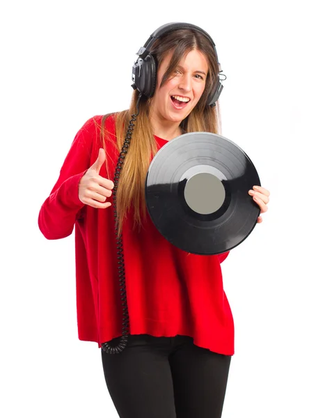 Young cool girl with headphones and vinyl — Stock Photo, Image