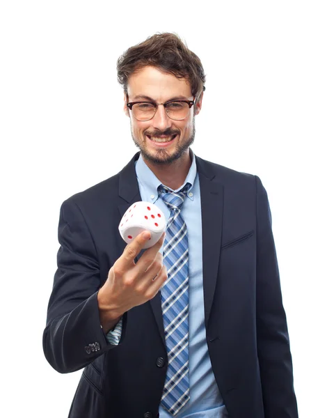 Young crazy businessman with a dice — Stock Photo, Image
