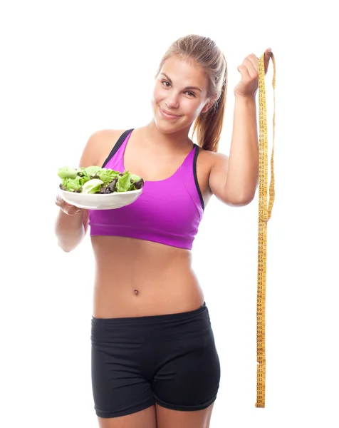 Young cool woman with a salad and a meter — Stock Photo, Image