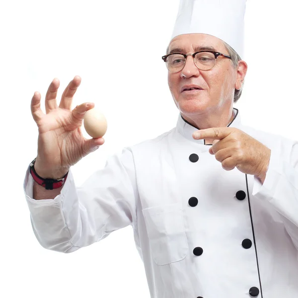 Senior cool man with an egg — Stock Photo, Image