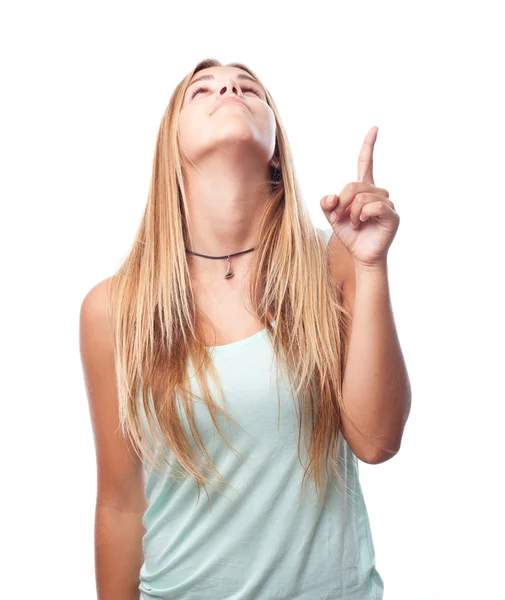Young cool woman pointing up — Stock Photo, Image