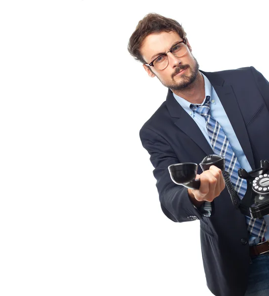 Jovem empresário louco oferecendo um telefone — Fotografia de Stock