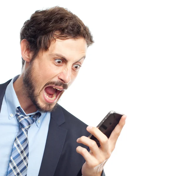 Young crazy businessman shouting on phone — Stock Photo, Image