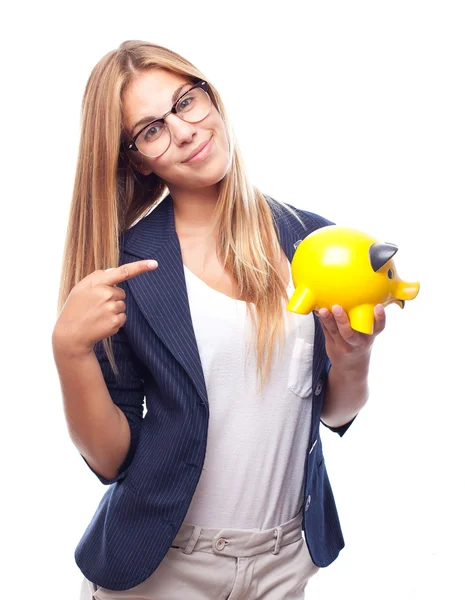 Young cool woman with a piggy bank — Stock Photo, Image