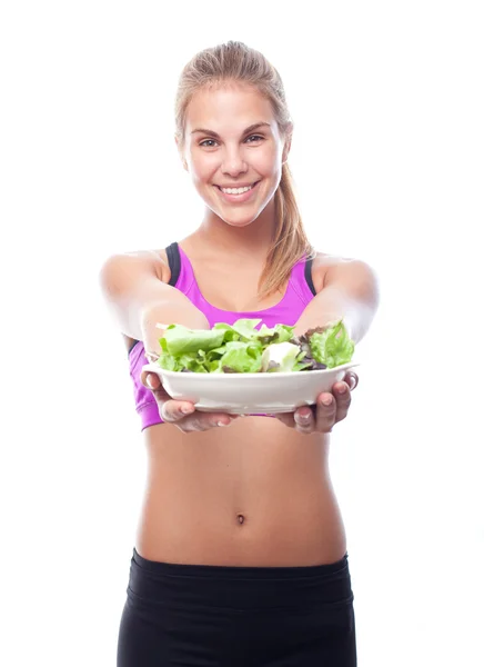 Young cool woman with a salad Royalty Free Stock Images