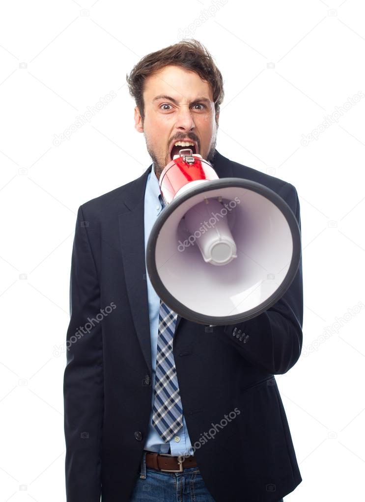 Young crazy businessman shouting on megaphone