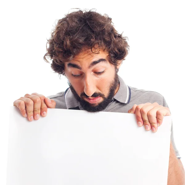 Young crazy man holding a placard — Stock Photo, Image