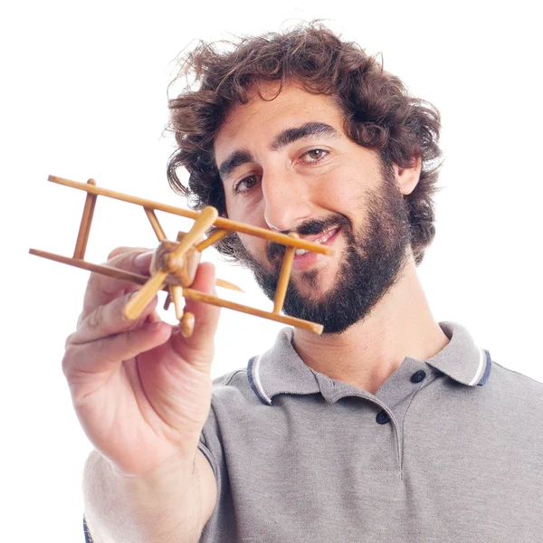 Joven loco con un avión de madera — Foto de Stock