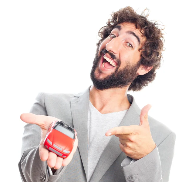 Young crazy man with a car toy — Stock Photo, Image