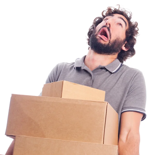 Young crazy man with heavy boxes — Stock Photo, Image