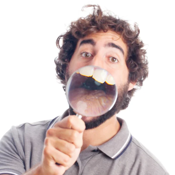 Young crazy man with a magnifier — Stock Photo, Image