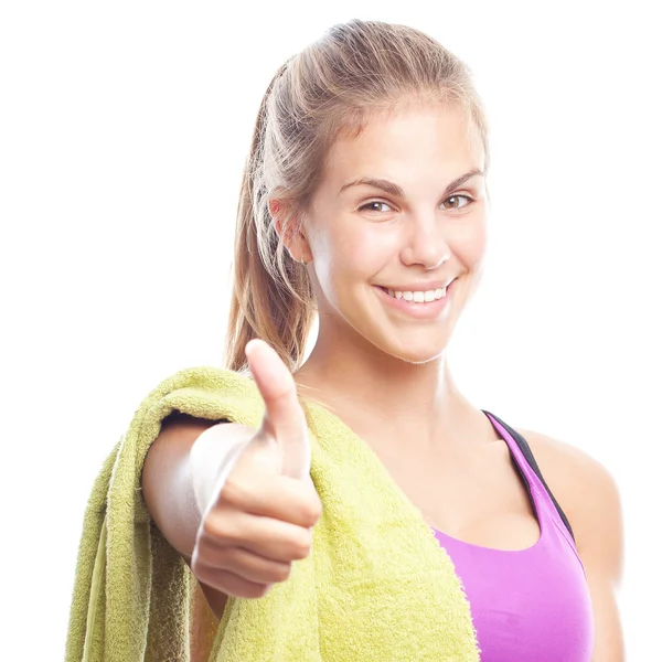 Young cool woman with a dumbbell and a towel all right gesture — Stock Photo, Image