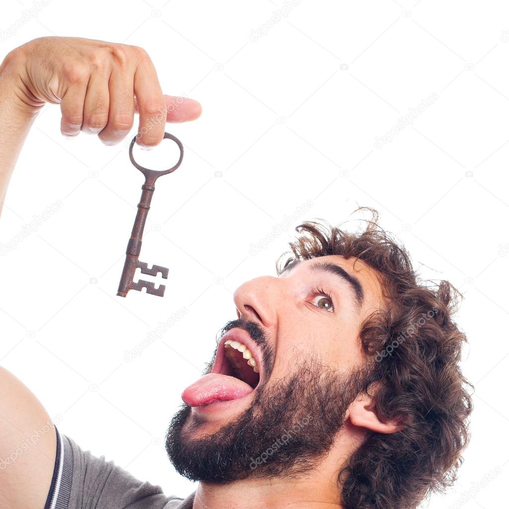 Young crazy man with an old key