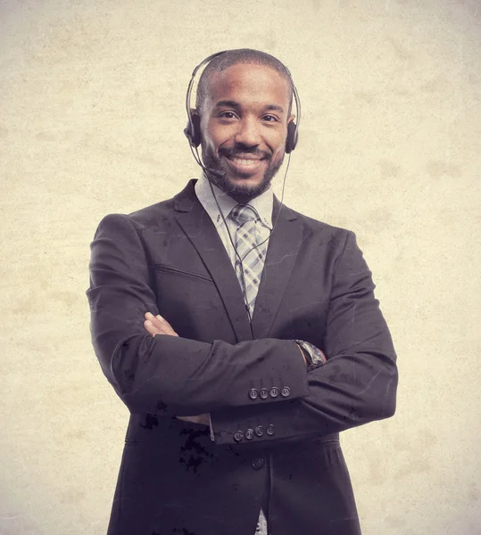 Jovem legal preto homem com telefones — Fotografia de Stock